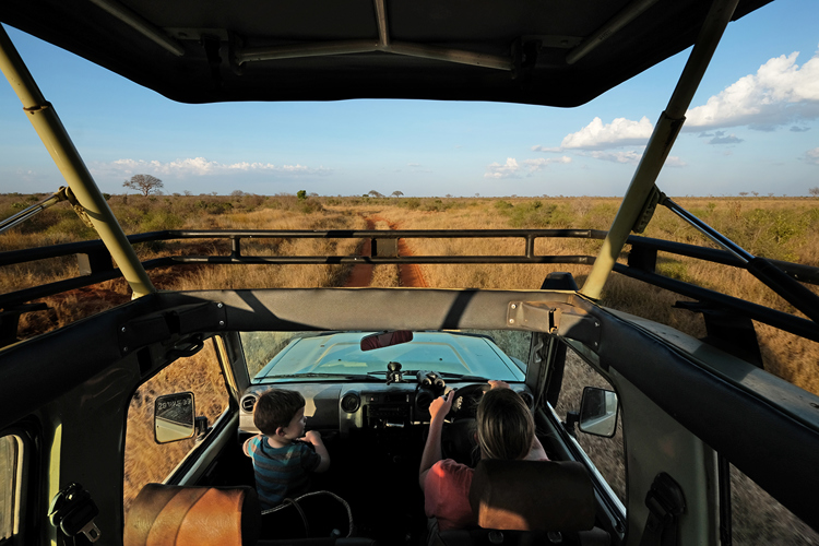 A family in their 4x4 during their self-drive safari in Kenya